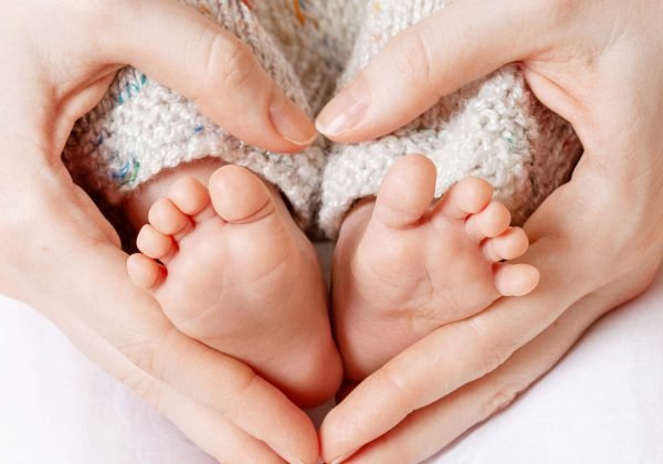 baby-feet-mother-hands-tiny-newborn-baby-s-feet-female-heart-shaped-hands-closeup